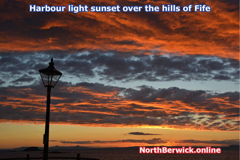 North Berwick: Sunset over Fife from the harbour wall